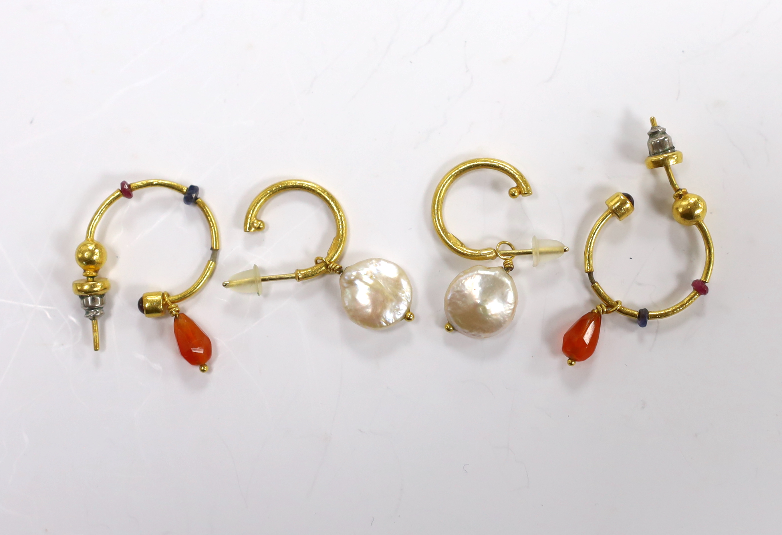 A pair of Middle Eastern 24k yellow metal and baroque cultured pearl set drop earrings, overall 31mm and one other pair of drop earrings.